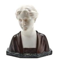 A Bronze and Marble Bust, Height 7 1/2 inches.