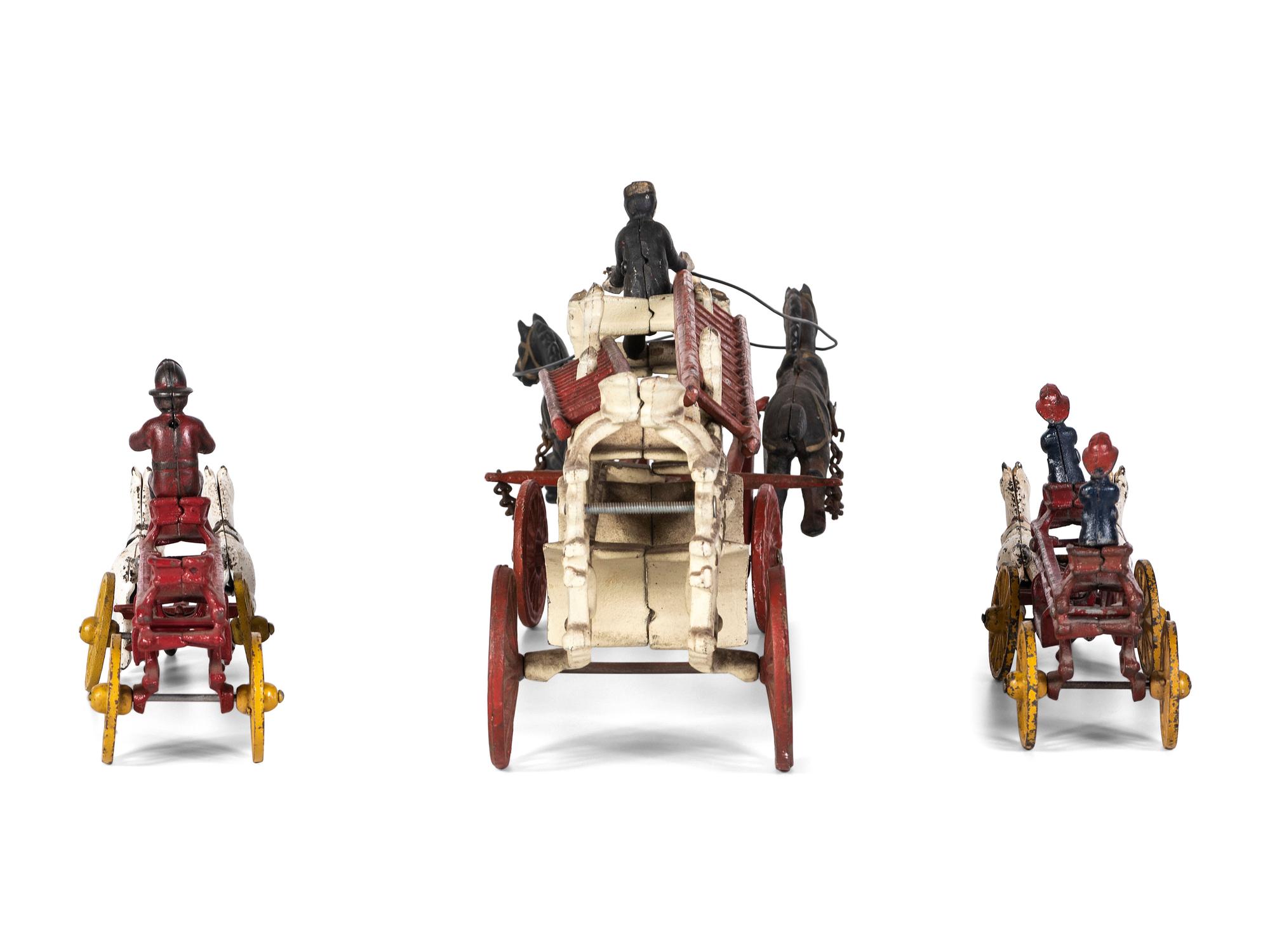 Three Painted Cast Iron Toy Horse Drawn Fire Wagons