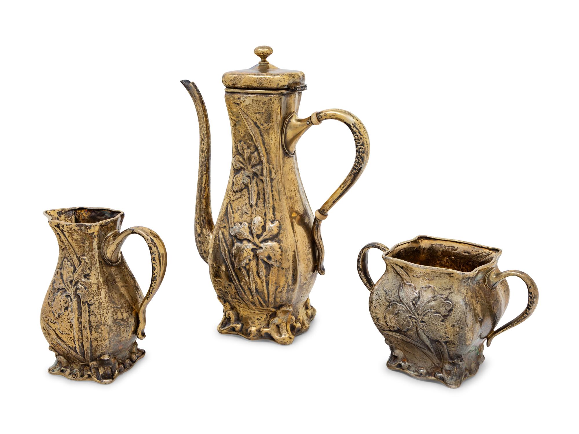 An American Silver-Gilt and Enamel Decorated Three-Piece Coffee Service