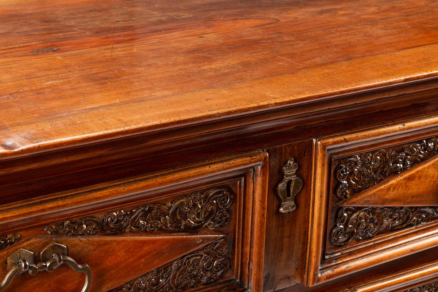 An Italian Baroque Style Walnut Chest of Drawers
