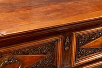 An Italian Baroque Style Walnut Chest of Drawers