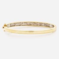 A 14K Yellow Gold and Diamond Bangel