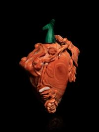 A Carved Red Coral Snuff Bottle