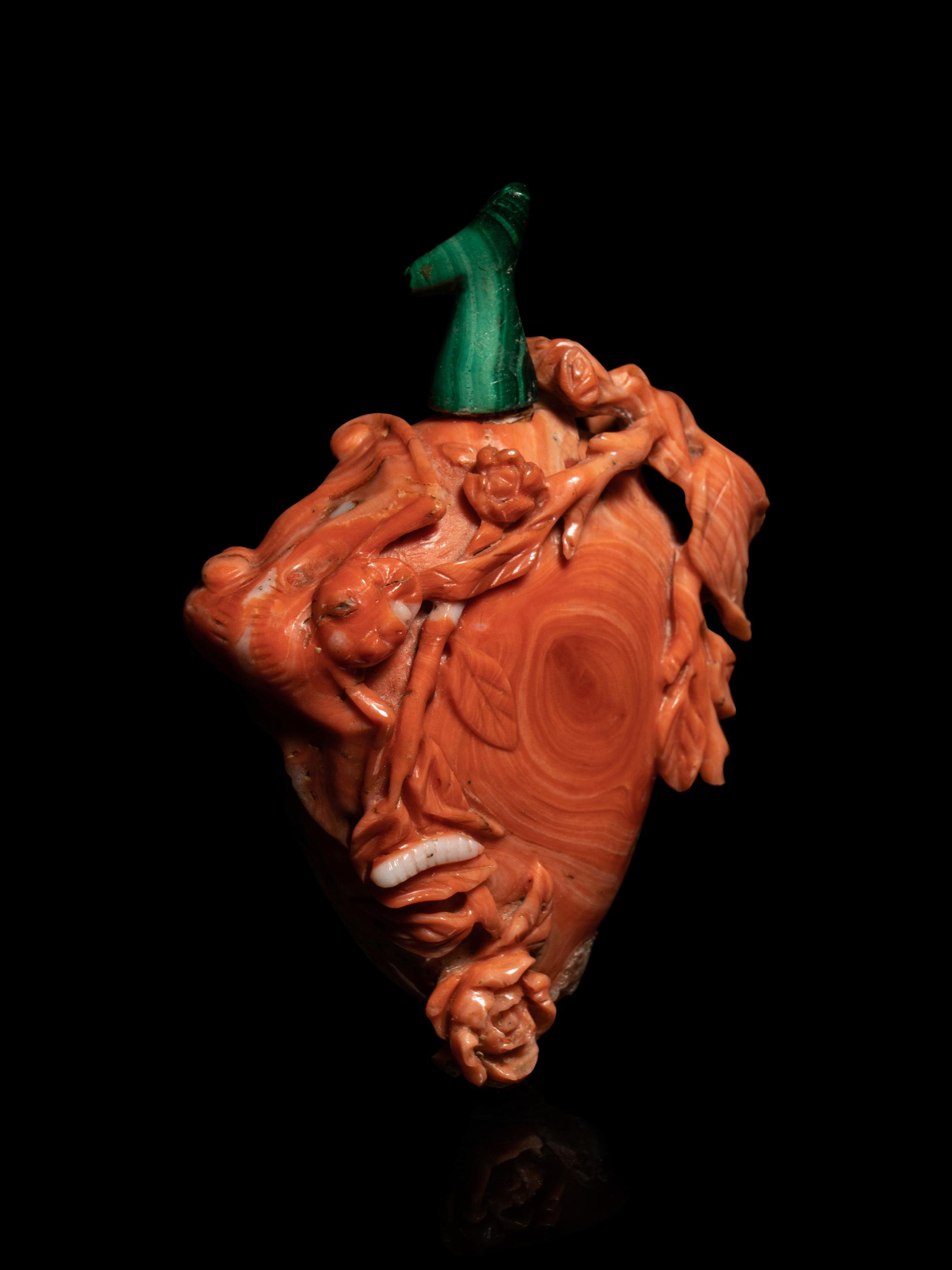 A Carved Red Coral Snuff Bottle