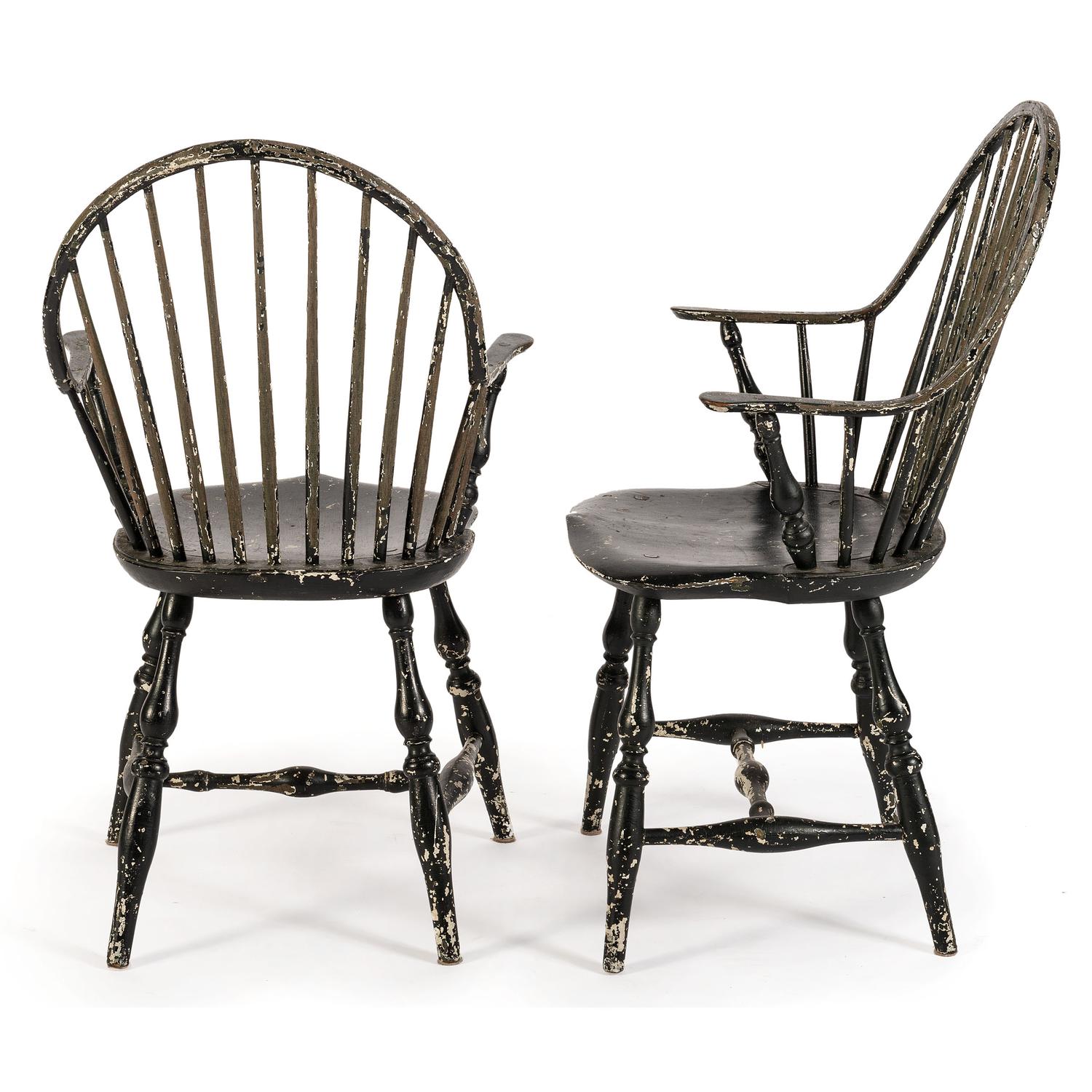 A Pair of Black-Painted Continuous Arm Windsor Chairs