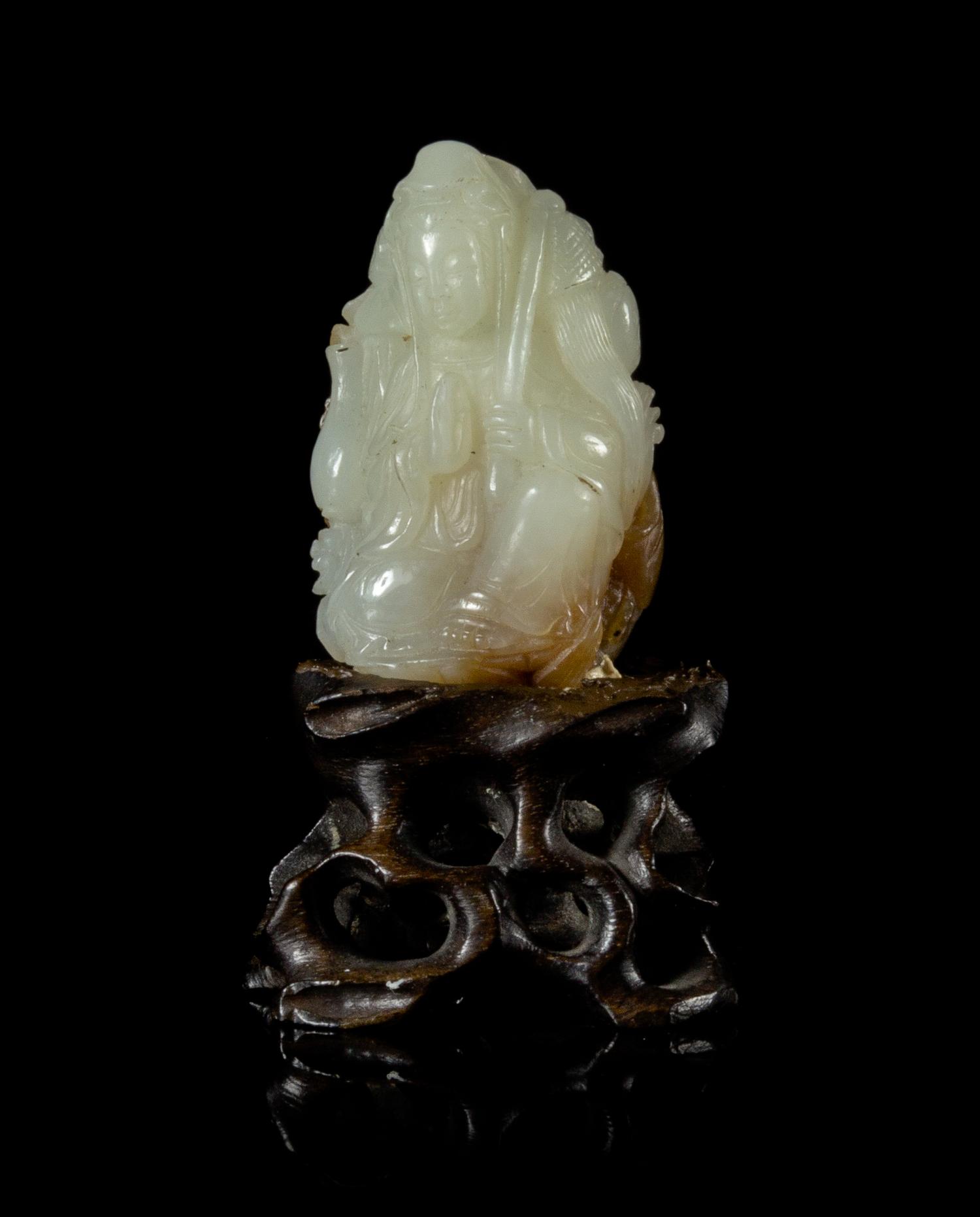 A White and Russet Jade Figural Group Height 2 inches. — 19TH CENTURY