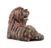 A Chinese Flambe Glazed Porcelain Figure of a Fu Lion