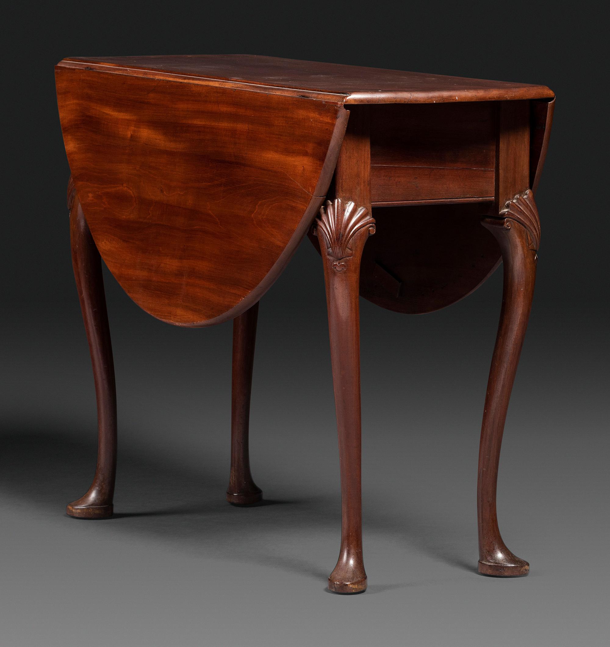 A Queen Anne Shell-Carved Mahogany Drop-Leaf Table