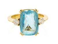A 14 Karat Yellow Gold, Blue Topaz and Diamond Ring, 3.90 dwts.