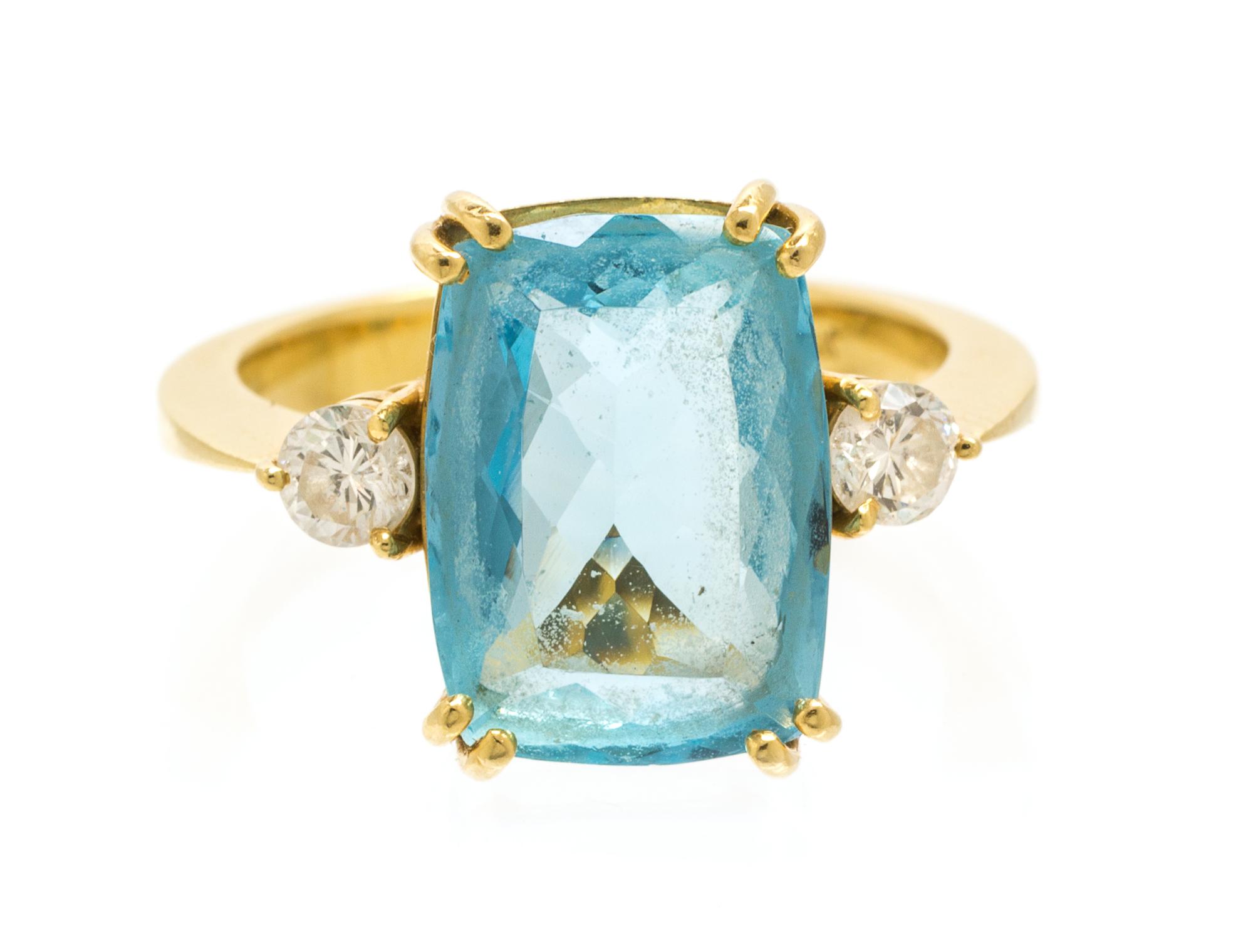 A 14 Karat Yellow Gold, Blue Topaz and Diamond Ring, 3.90 dwts.
