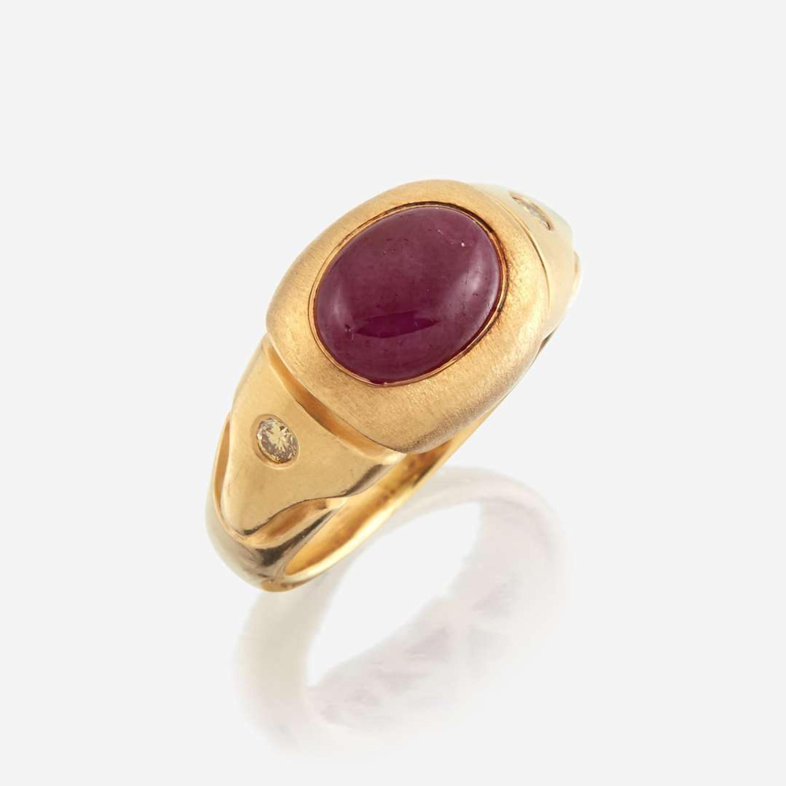 A twenty-two karat gold, ruby, and colored diamond ring