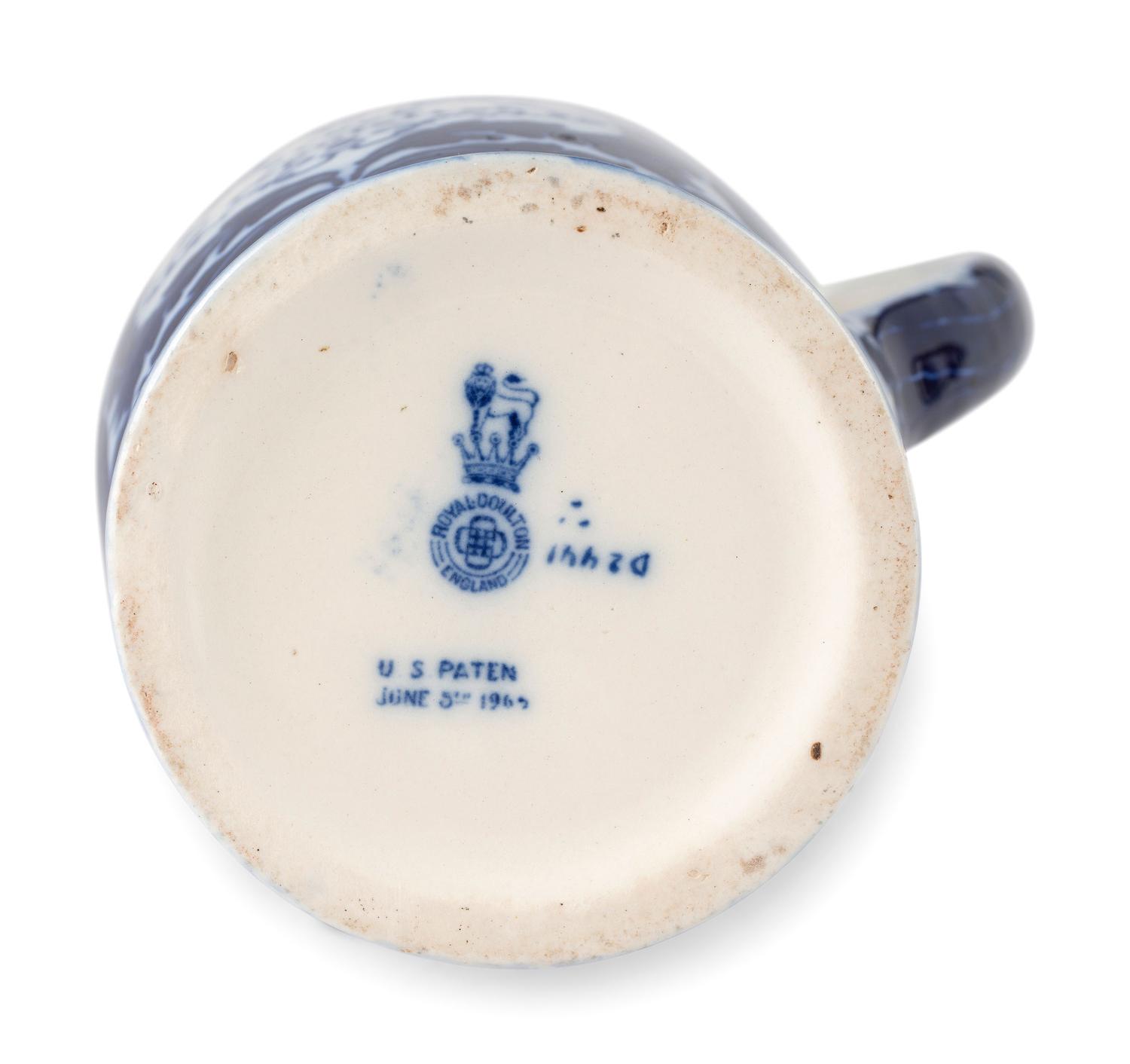 A Creamware Teapot, Rockingham Pitcher, and Royal Doulton Pitcher