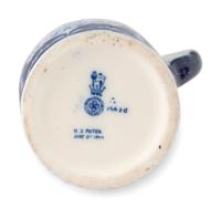 A Creamware Teapot, Rockingham Pitcher, and Royal Doulton Pitcher