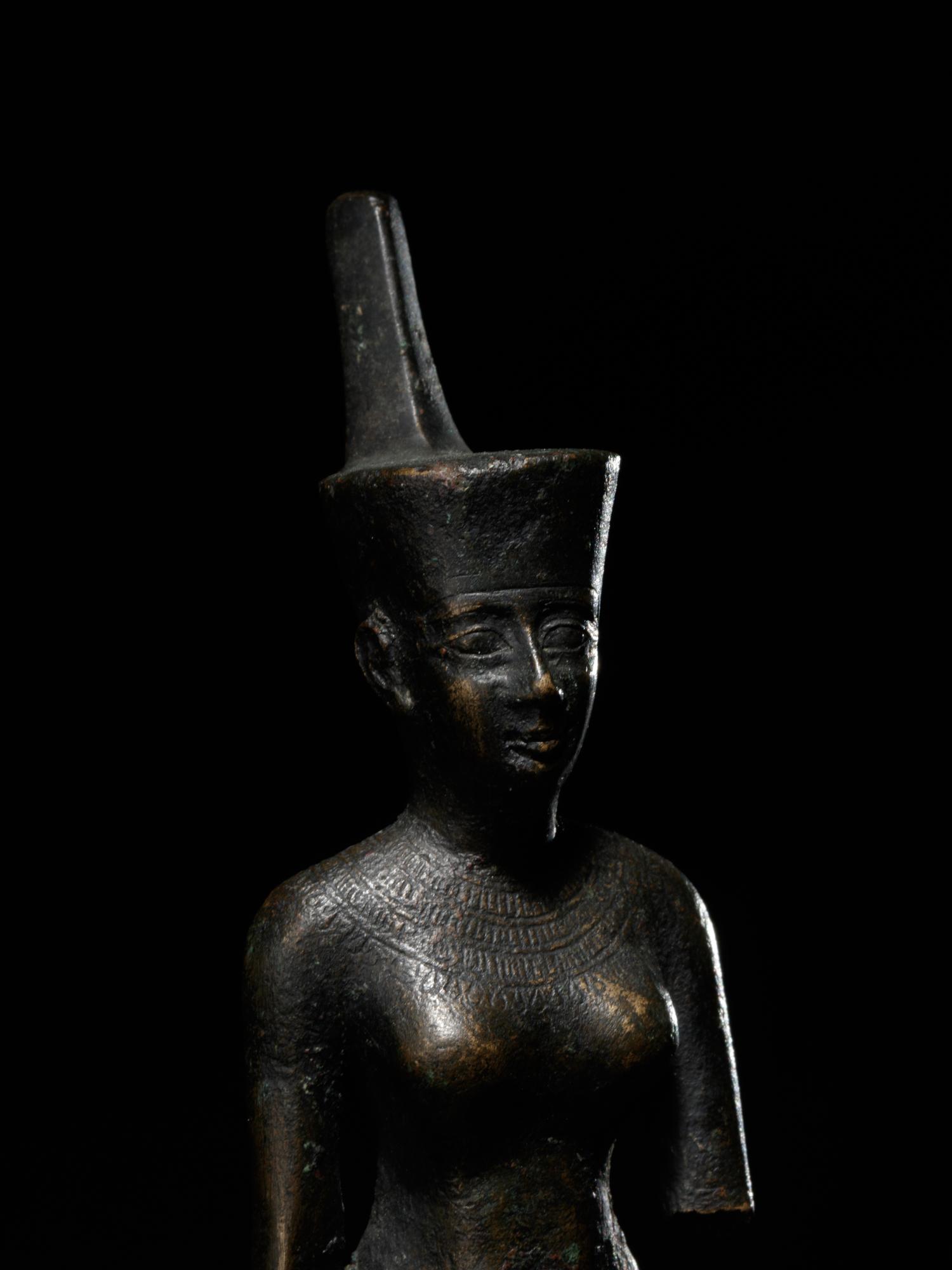 An Egyptian Bronze Striding Neith