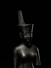 An Egyptian Bronze Striding Neith