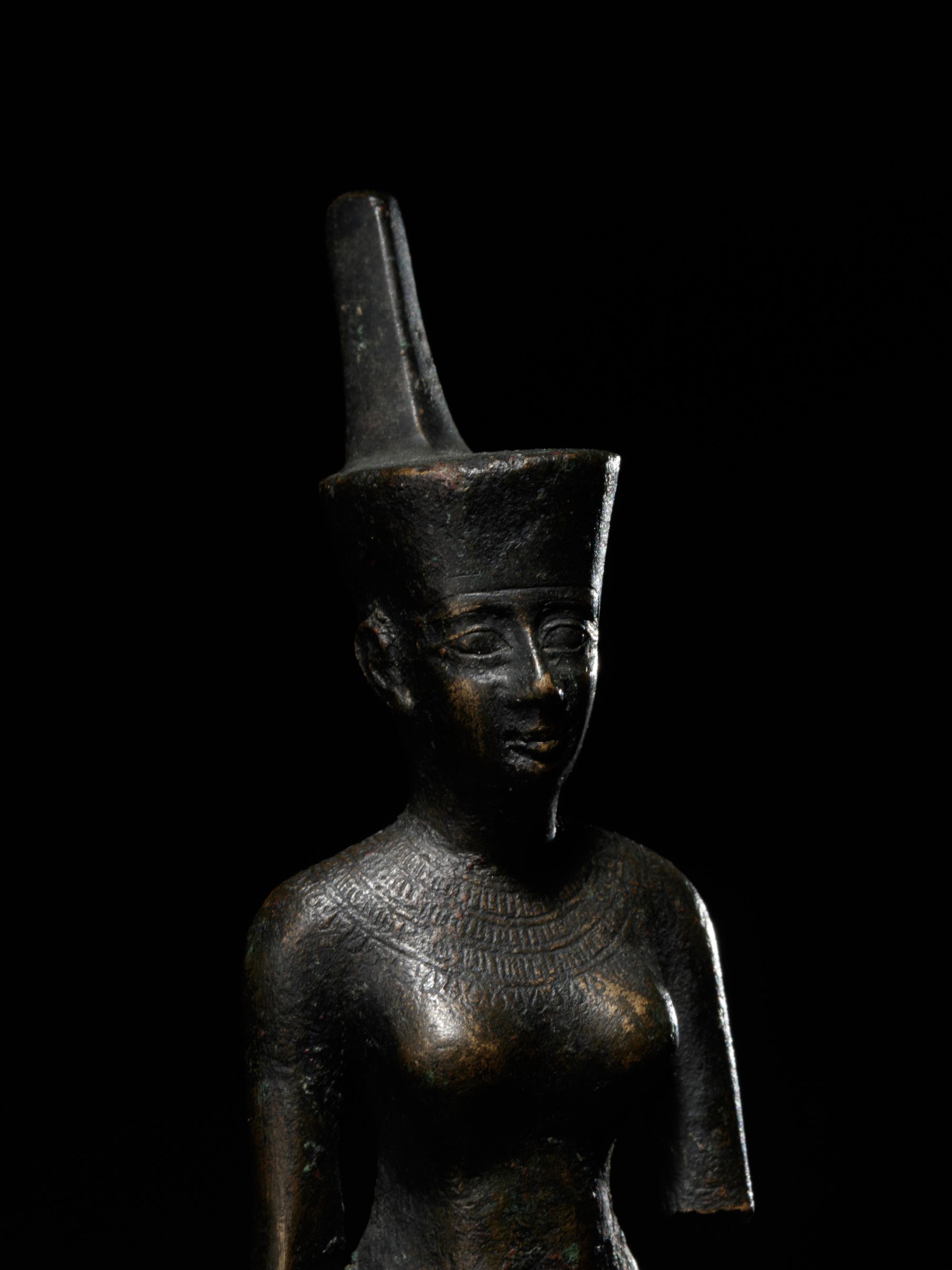An Egyptian Bronze Striding Neith
