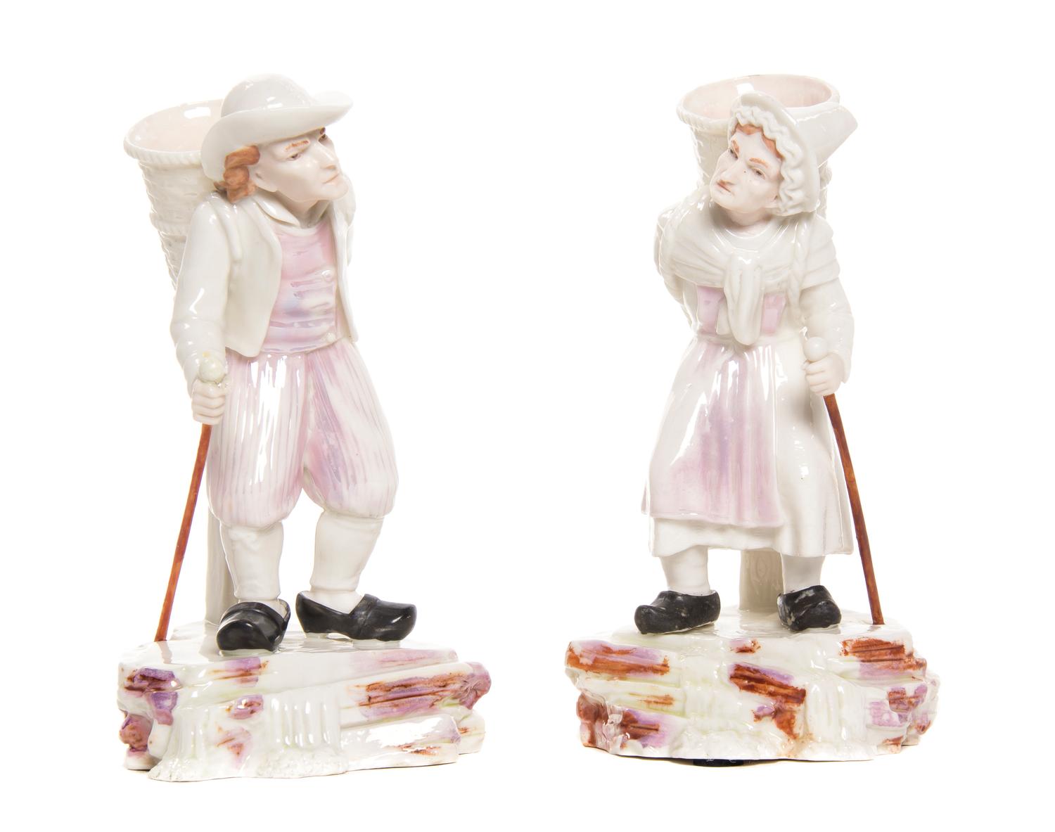 A Pair of Belleek Belgian Hawker Figures, Height of first 6 5/8 inches.