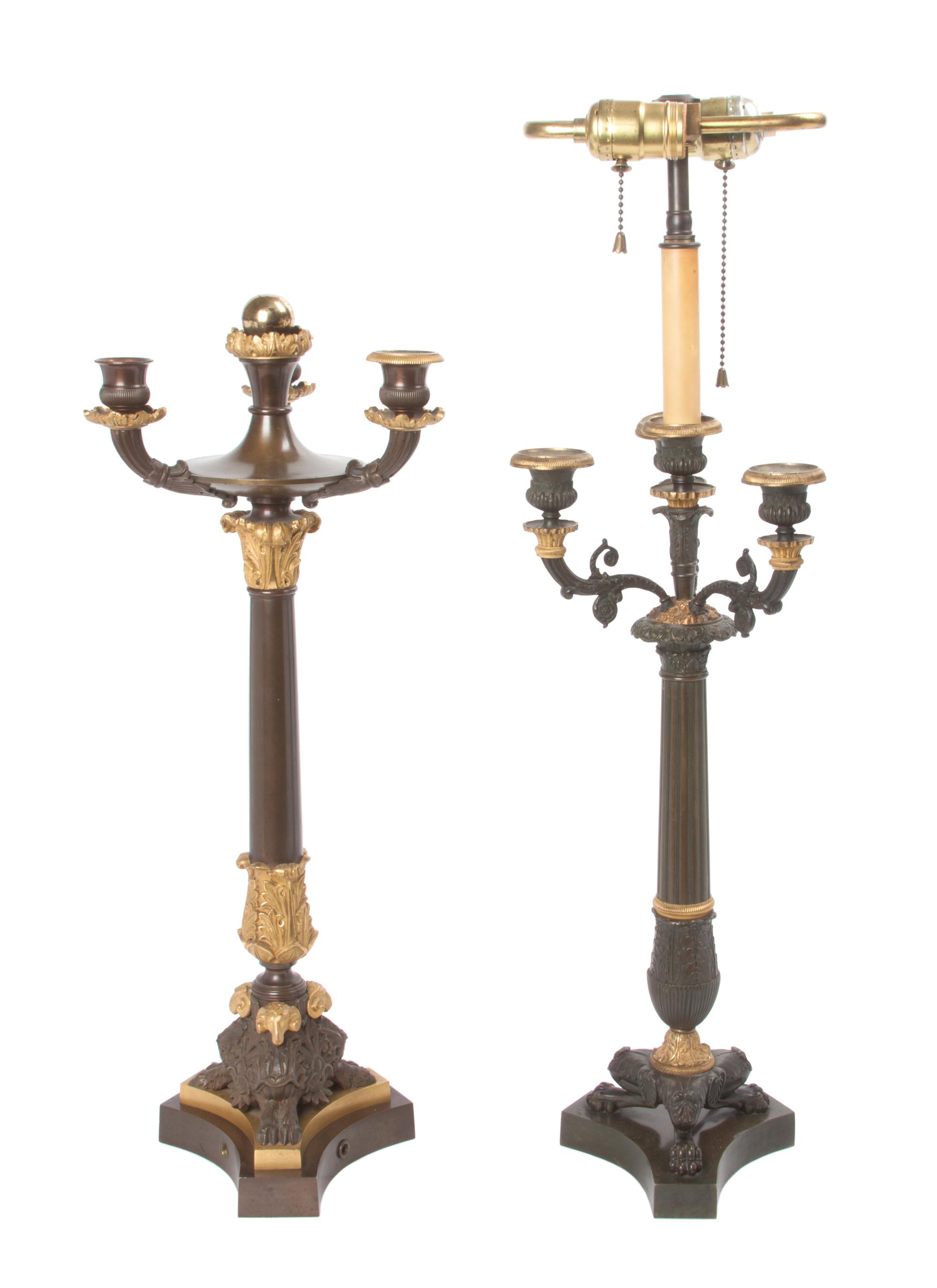 An Empire Gilt and Patinated Bronze Four-Light Candelabra Height of first 26 1/2 inches.