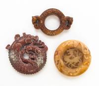 Three Pierce Carved Stone Plaques Diameter of first 3 inches.