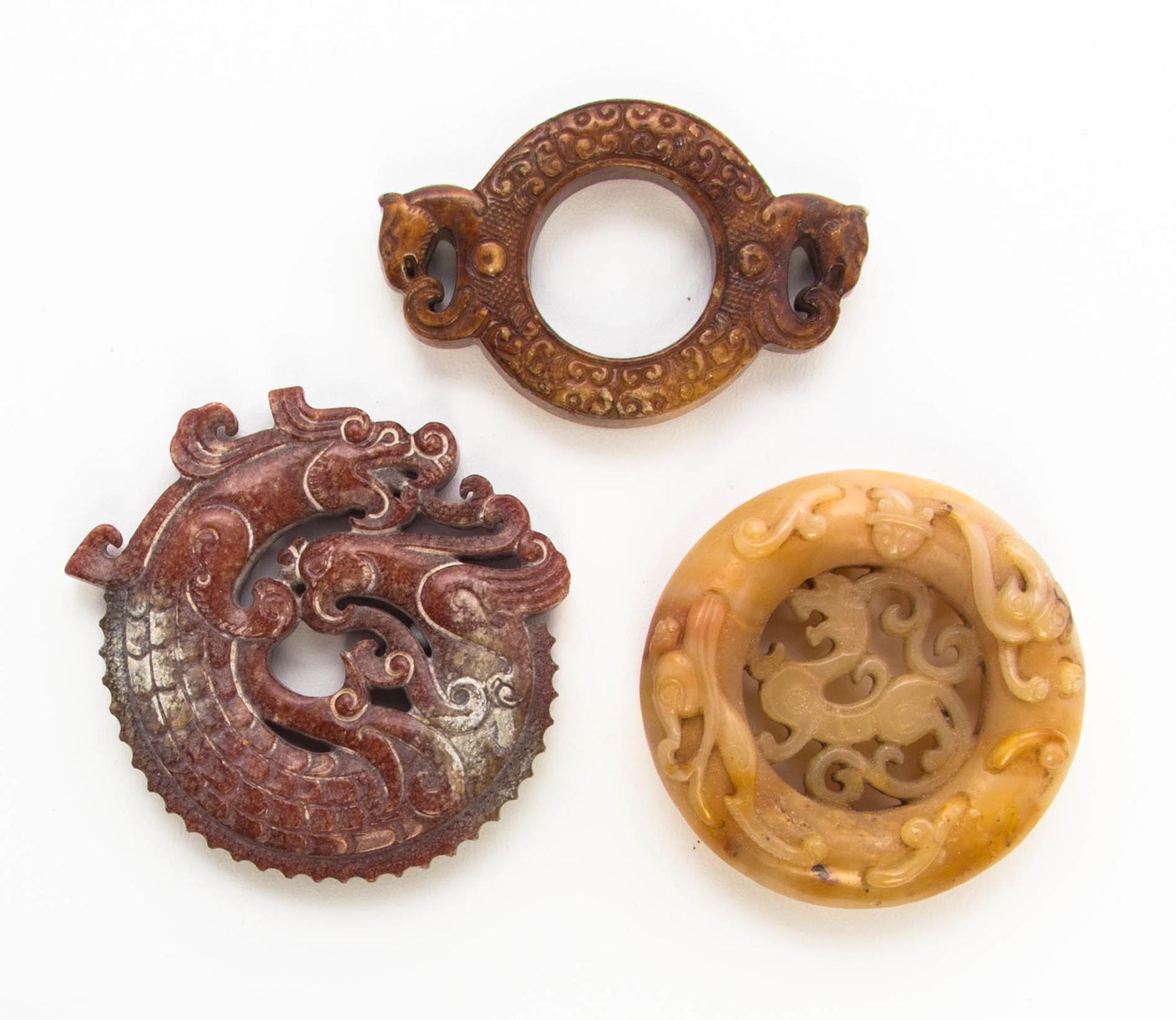 Three Pierce Carved Stone Plaques Diameter of first 3 inches.
