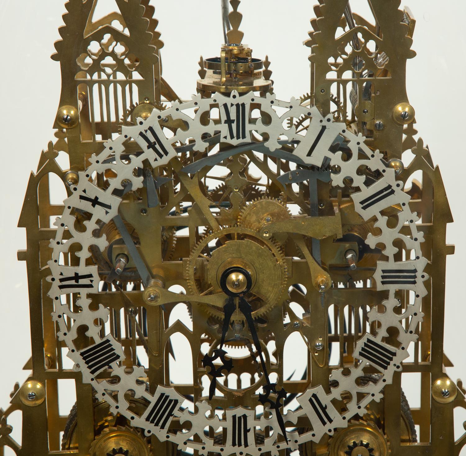 An English Gothic Revival Brass Musical Skeleton Clock