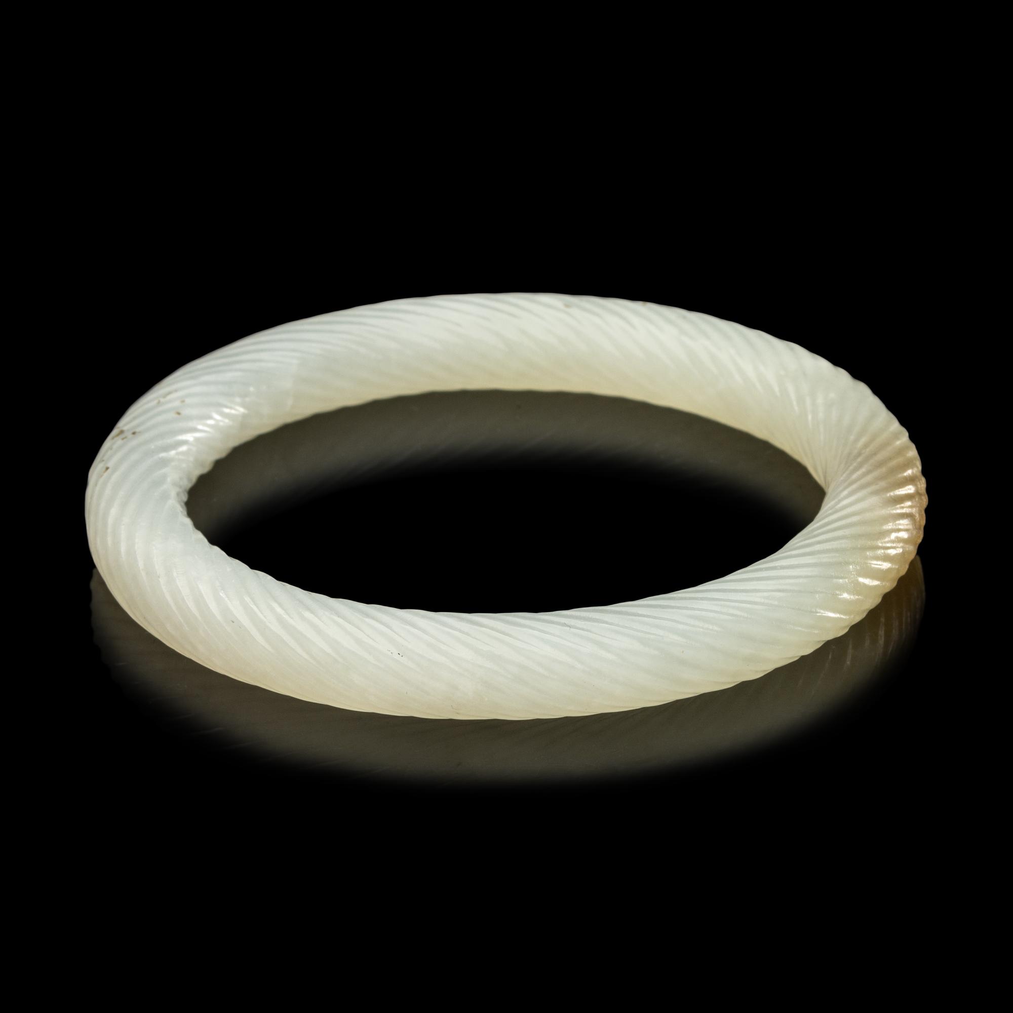 A Chinese Carved Jade Bangle