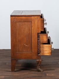 AWAITING DONATION - A Classical Carved Walnut-Veneered Chest of Drawers