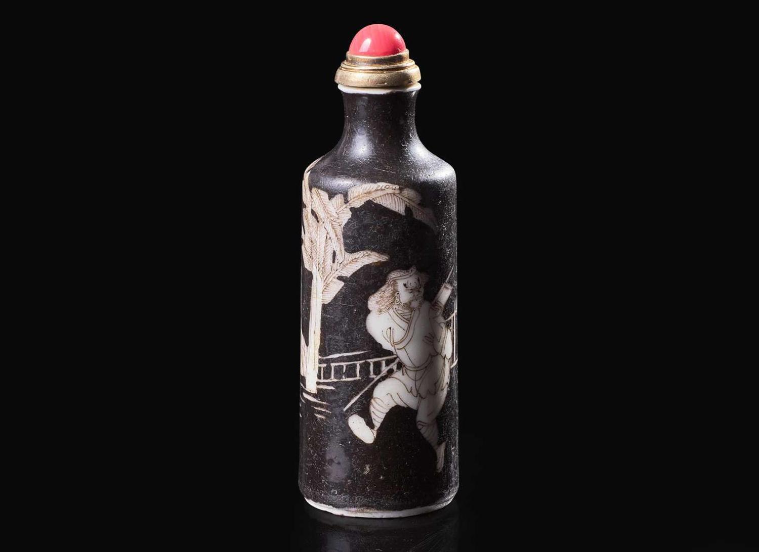 A Chinese black-ground porcelain snuff bottle, Daoguang mark and of the period 黑釉鼻煙壺 道光款 清 道光
