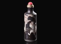 A Chinese black-ground porcelain snuff bottle, Daoguang mark and of the period 黑釉鼻煙壺 道光款 清 道光
