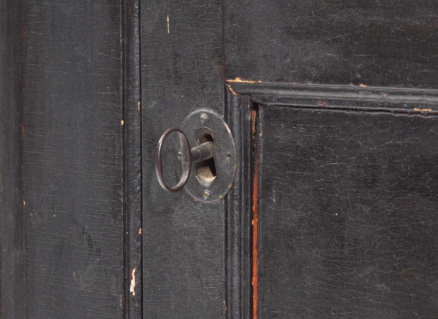 A Chippendale black-painted pine hanging corner cupboard, late 18th century
