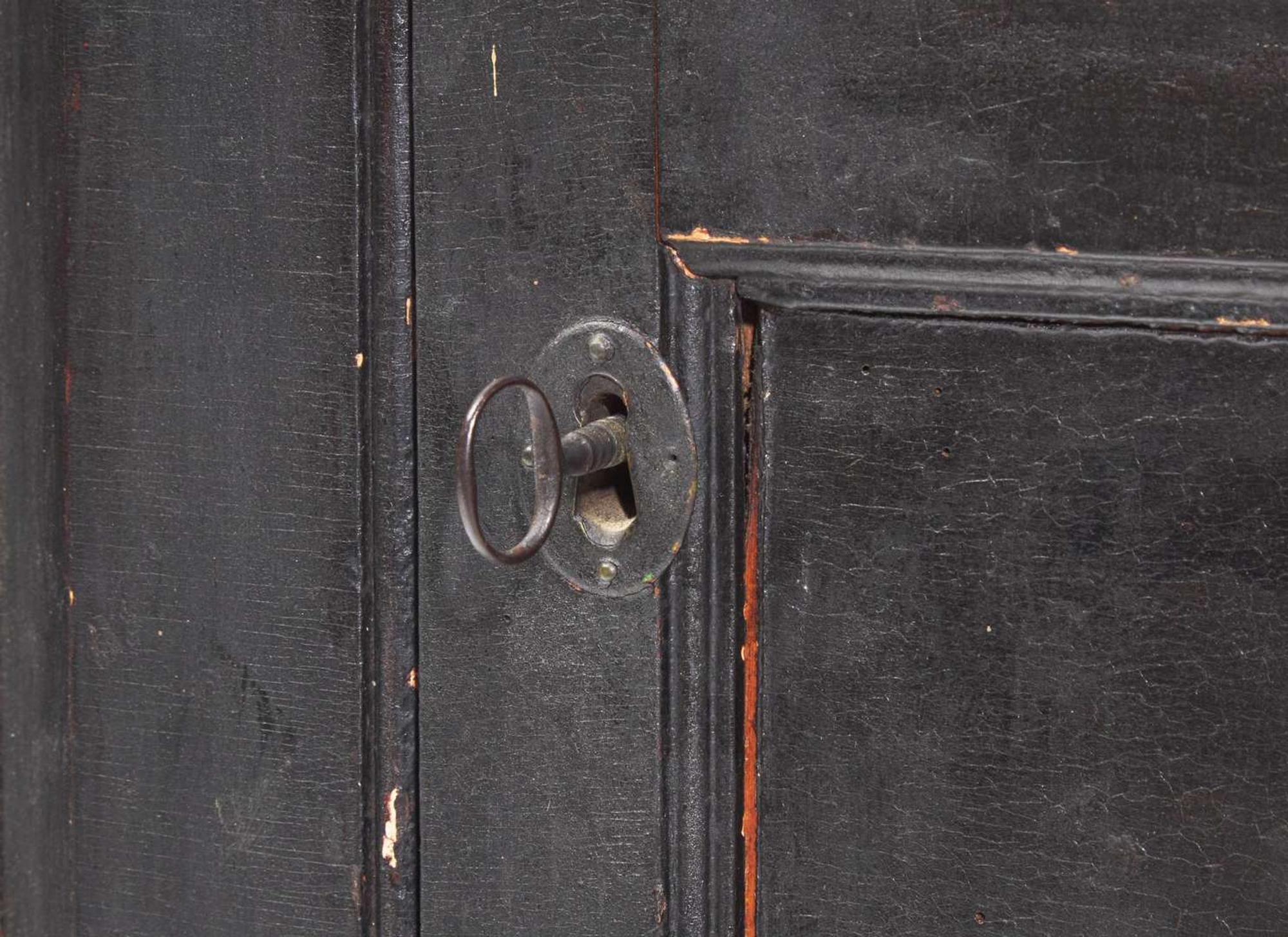 A Chippendale black-painted pine hanging corner cupboard, late 18th century