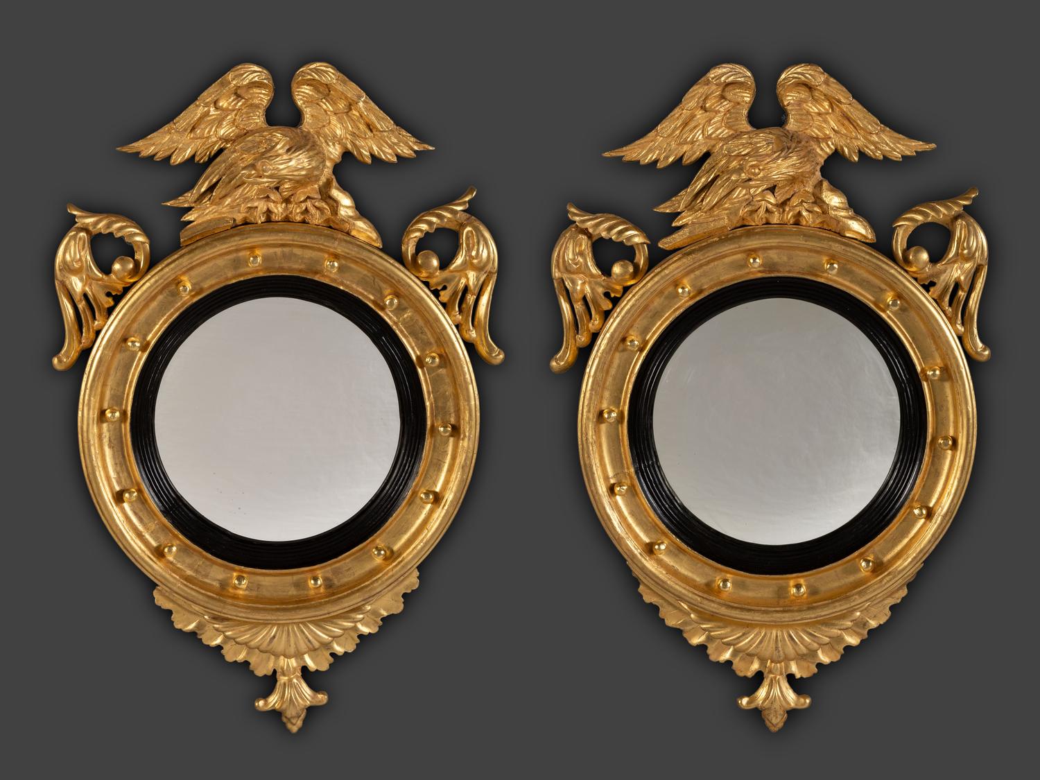 A Pair of Federal Giltwood Bull's Eye Looking Glasses