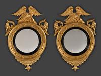 A Pair of Federal Giltwood Bull's Eye Looking Glasses