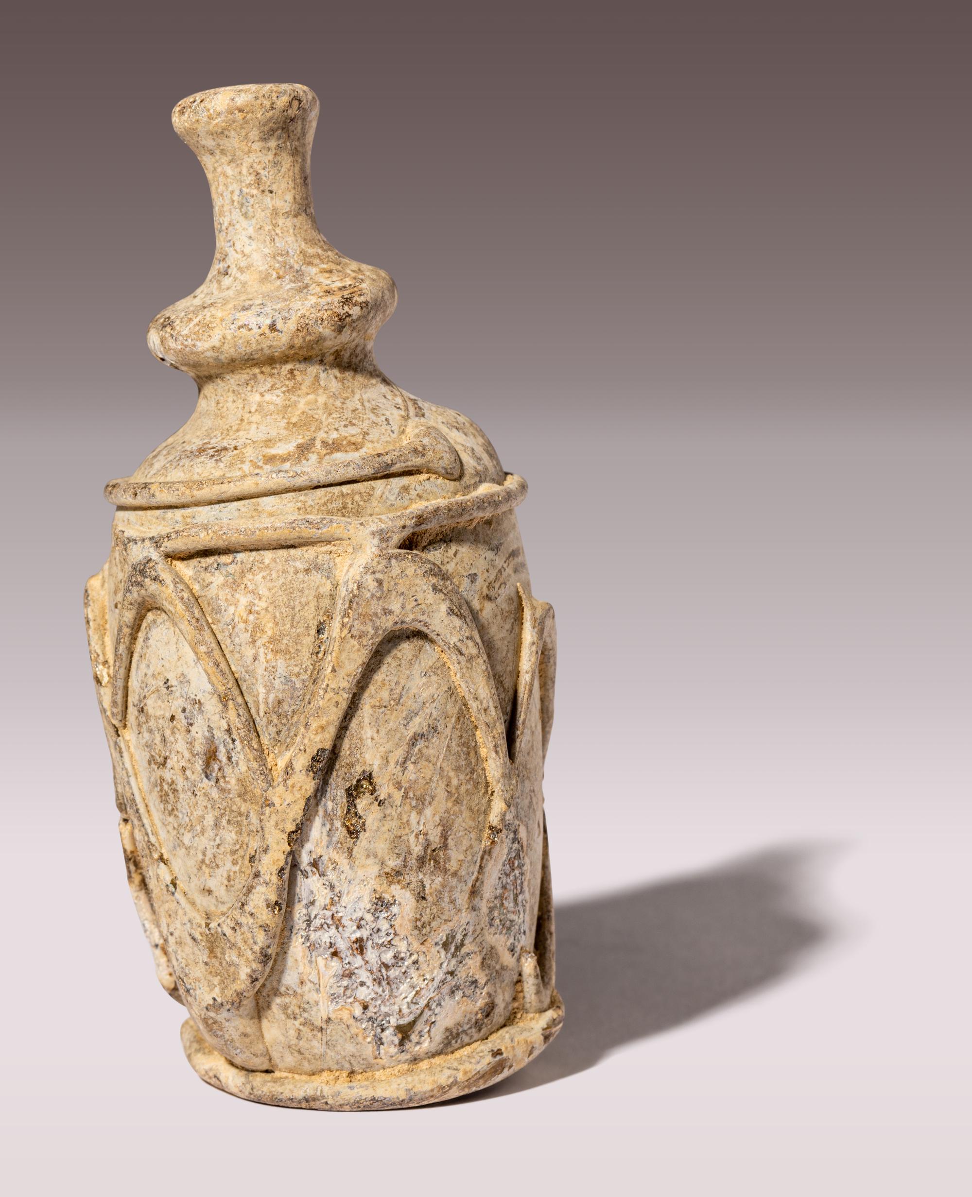 An Islamic Yellow-Green Glass Bottle