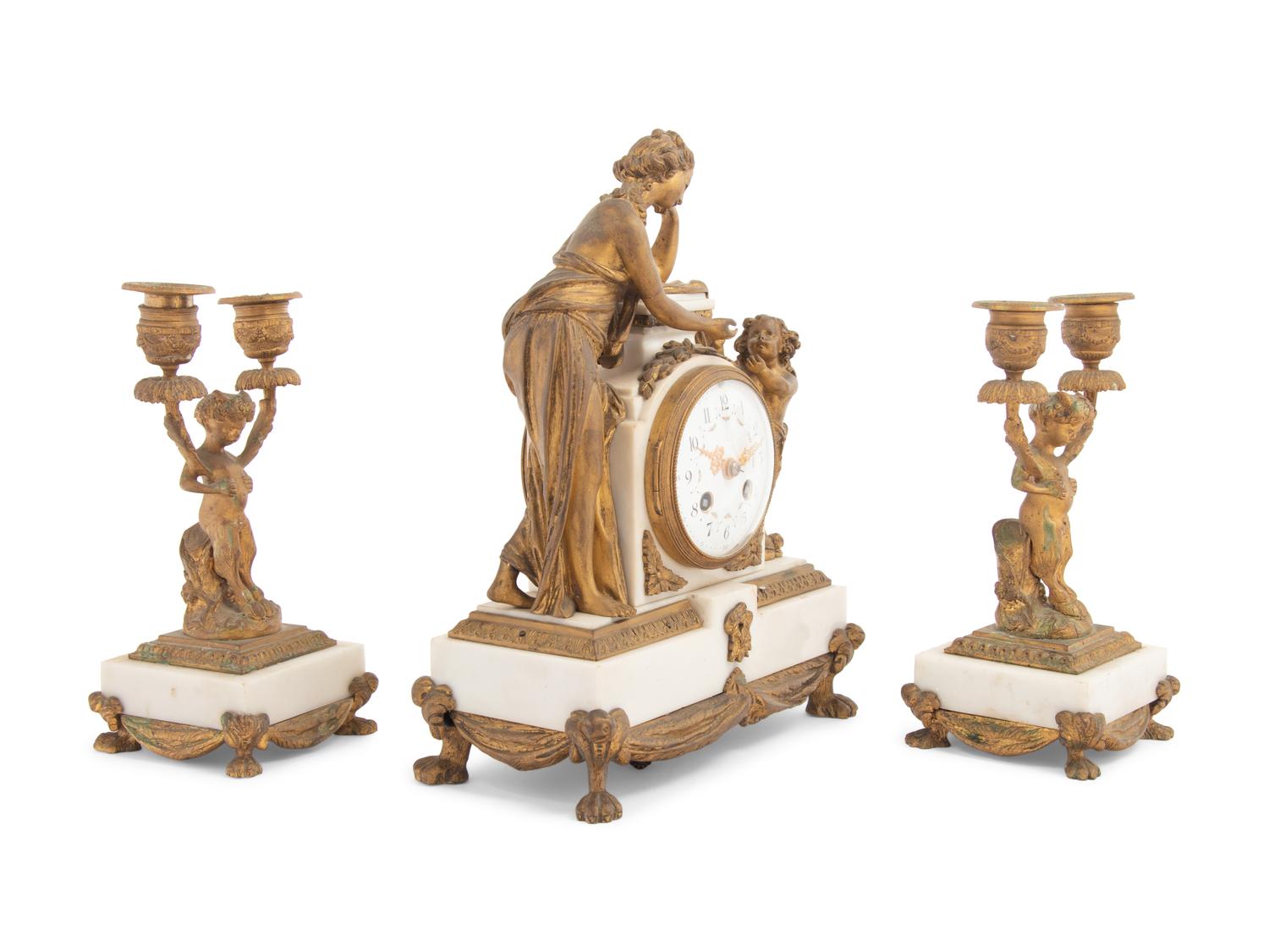 A French Gilt Bronze and Marble Clock Garniture