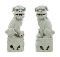 A Pair of Chinese Blue Glazed Porcelain Figures of Fu Lions