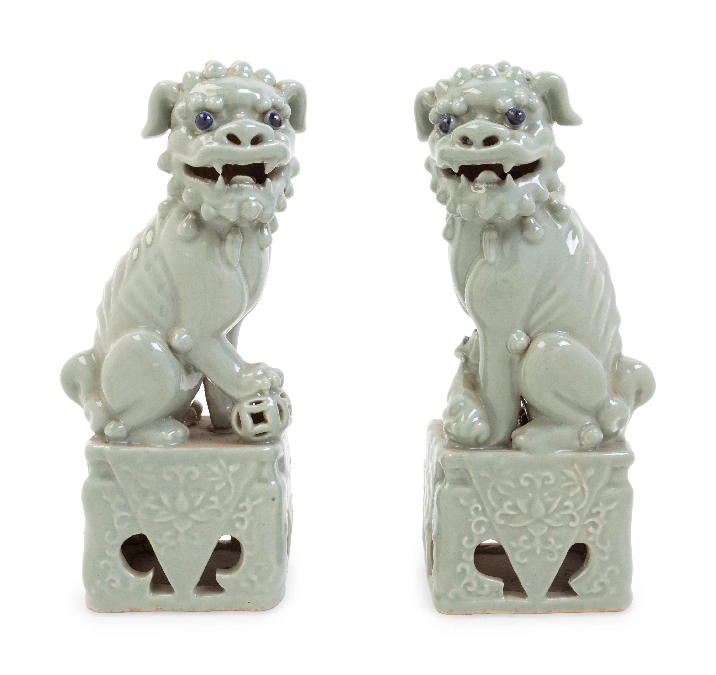 A Pair of Chinese Blue Glazed Porcelain Figures of Fu Lions