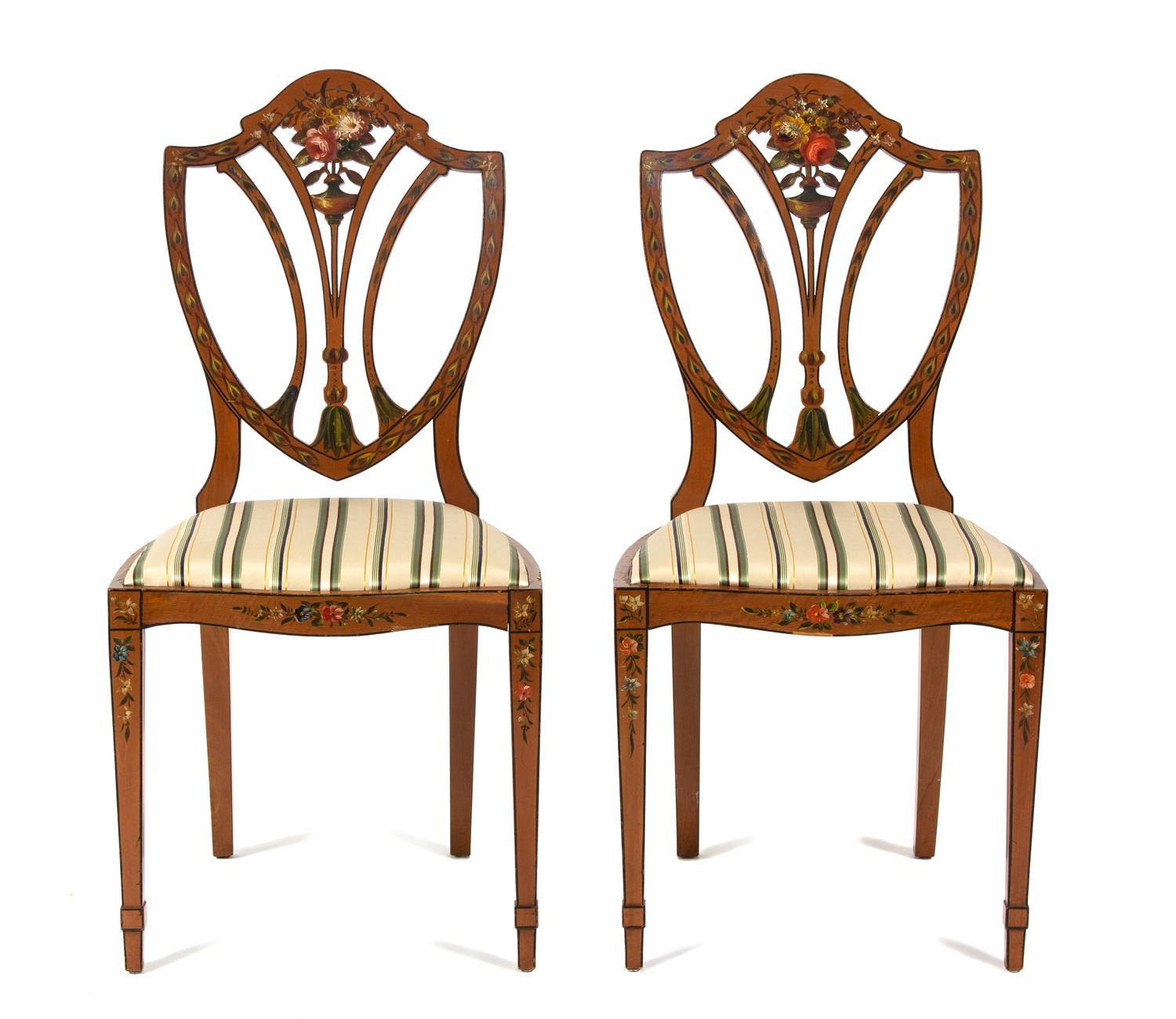 A Pair of Polychrome Floral Painted Satinwood Chairs Height 36 x width 18 x depth 15 1/2 inches.
