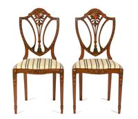 A Pair of Polychrome Floral Painted Satinwood Chairs Height 36 x width 18 x depth 15 1/2 inches.