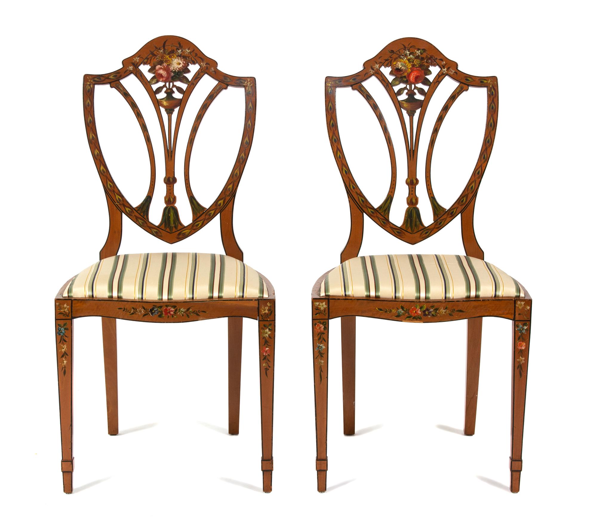 A Pair of Polychrome Floral Painted Satinwood Chairs Height 36 x width 18 x depth 15 1/2 inches.