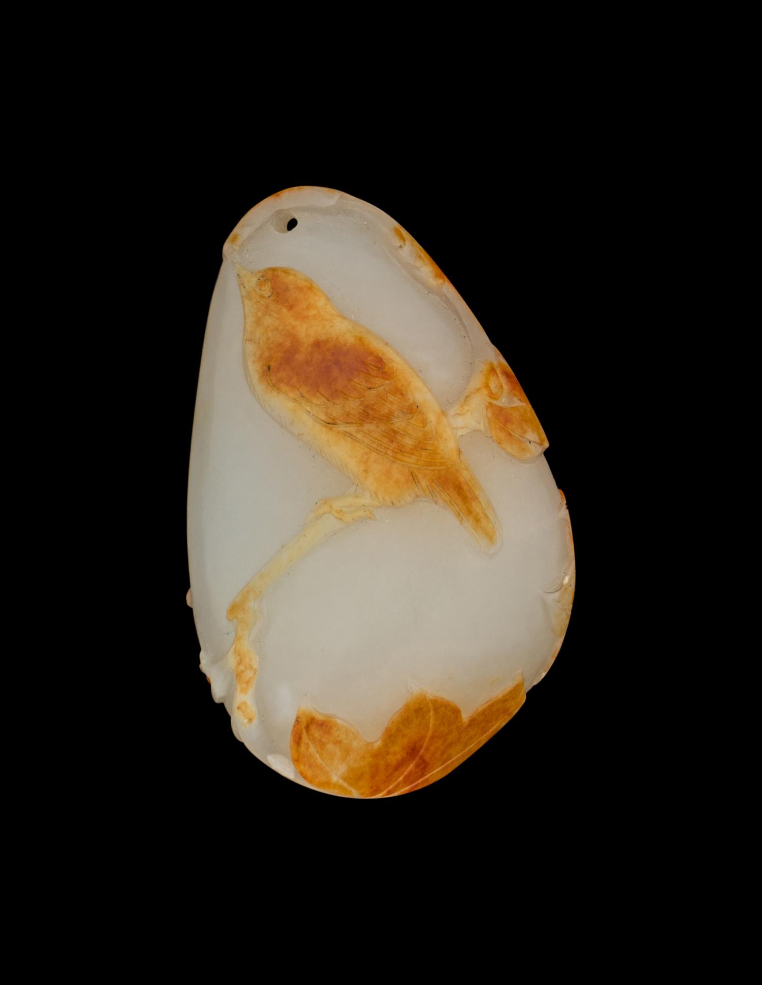 A Chinese Russet and White Jade 'Bird' Pendant