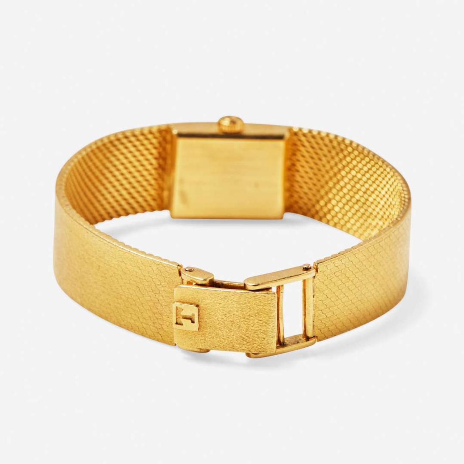 An 18K Yellow Gold Ladies Tissot Watch