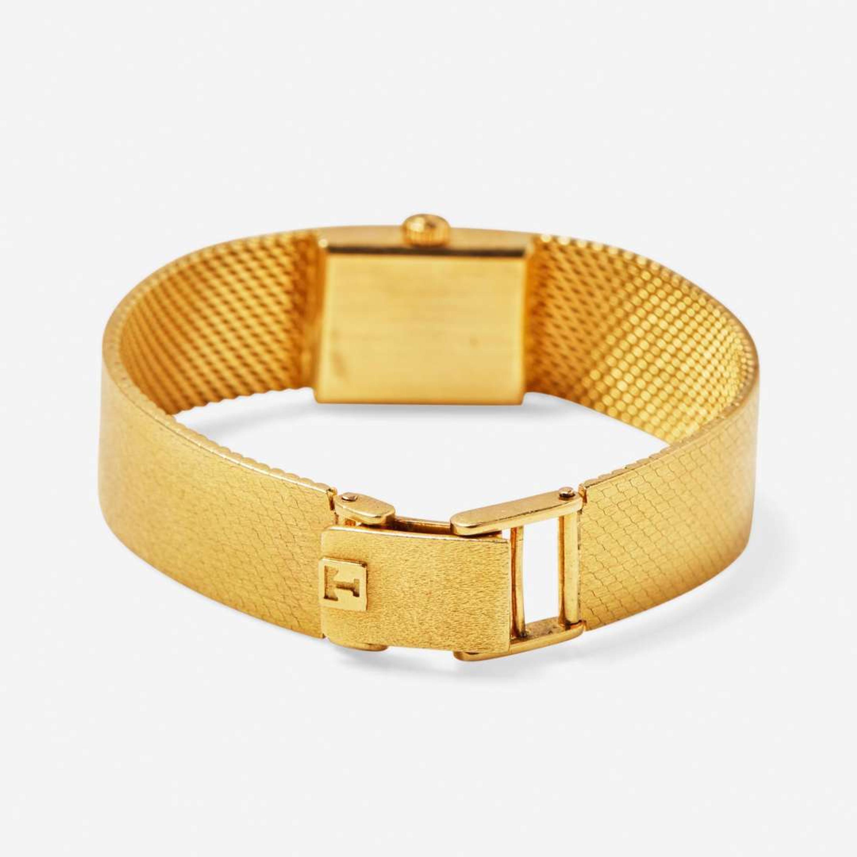 An 18K Yellow Gold Ladies Tissot Watch