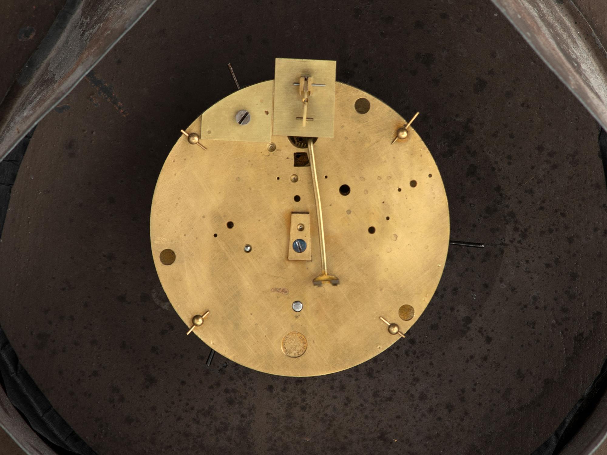 A French Painted and Parcel Gilt Tin Shop Wall Clock