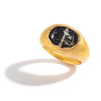 A Roman Gold and Banded Glass Finger Ring with a Kneeling Hero