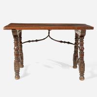 A Spanish Baroque carved walnut and iron stretcher table Probably 17th century