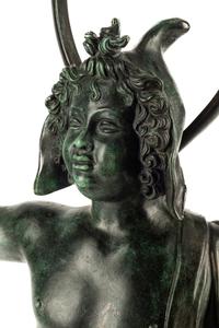 A Continental Patinated Bronze Figure with a Rock Crystal Ornament