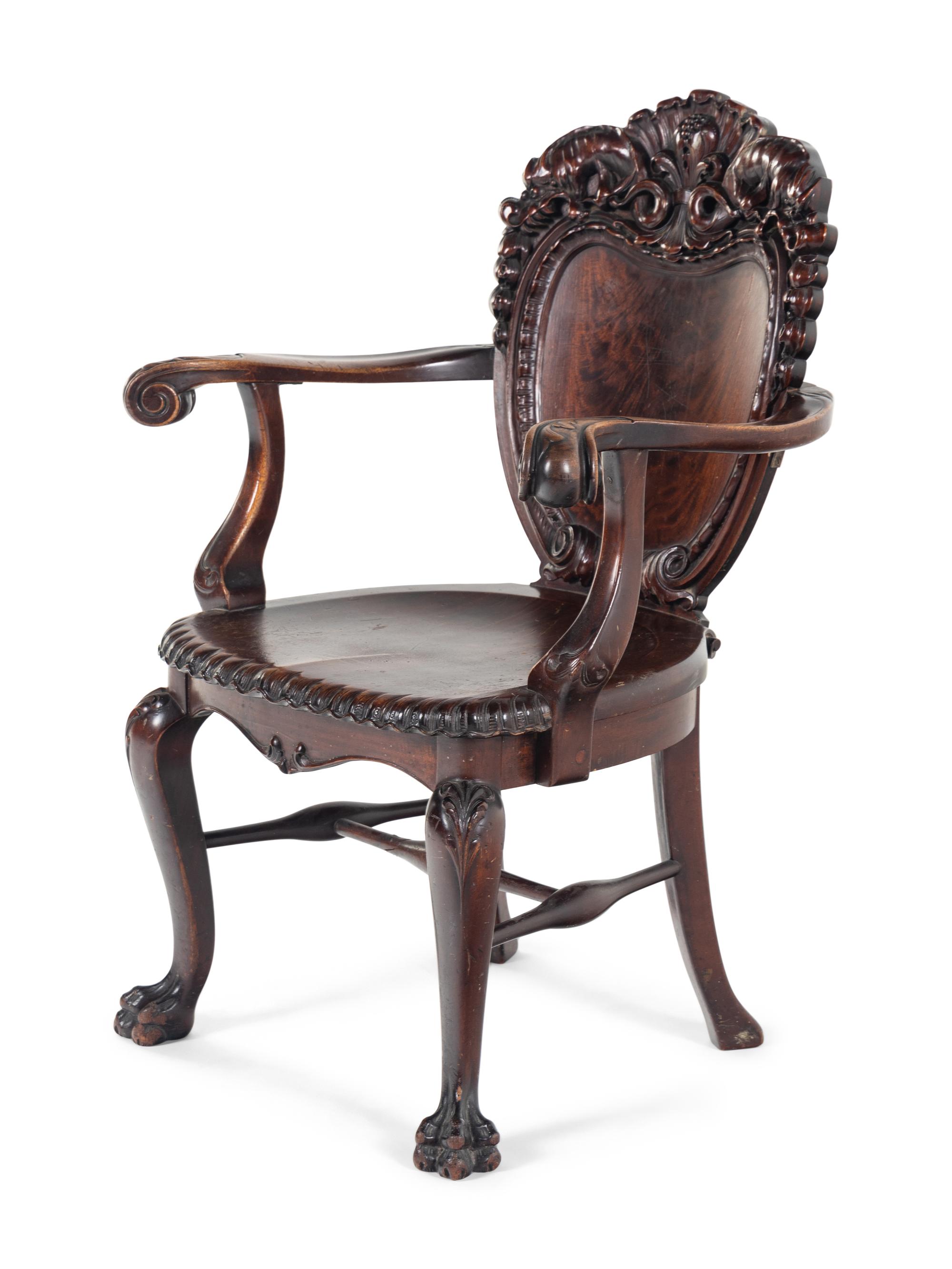 A Baroque Revival Carved Mahogany Armchair