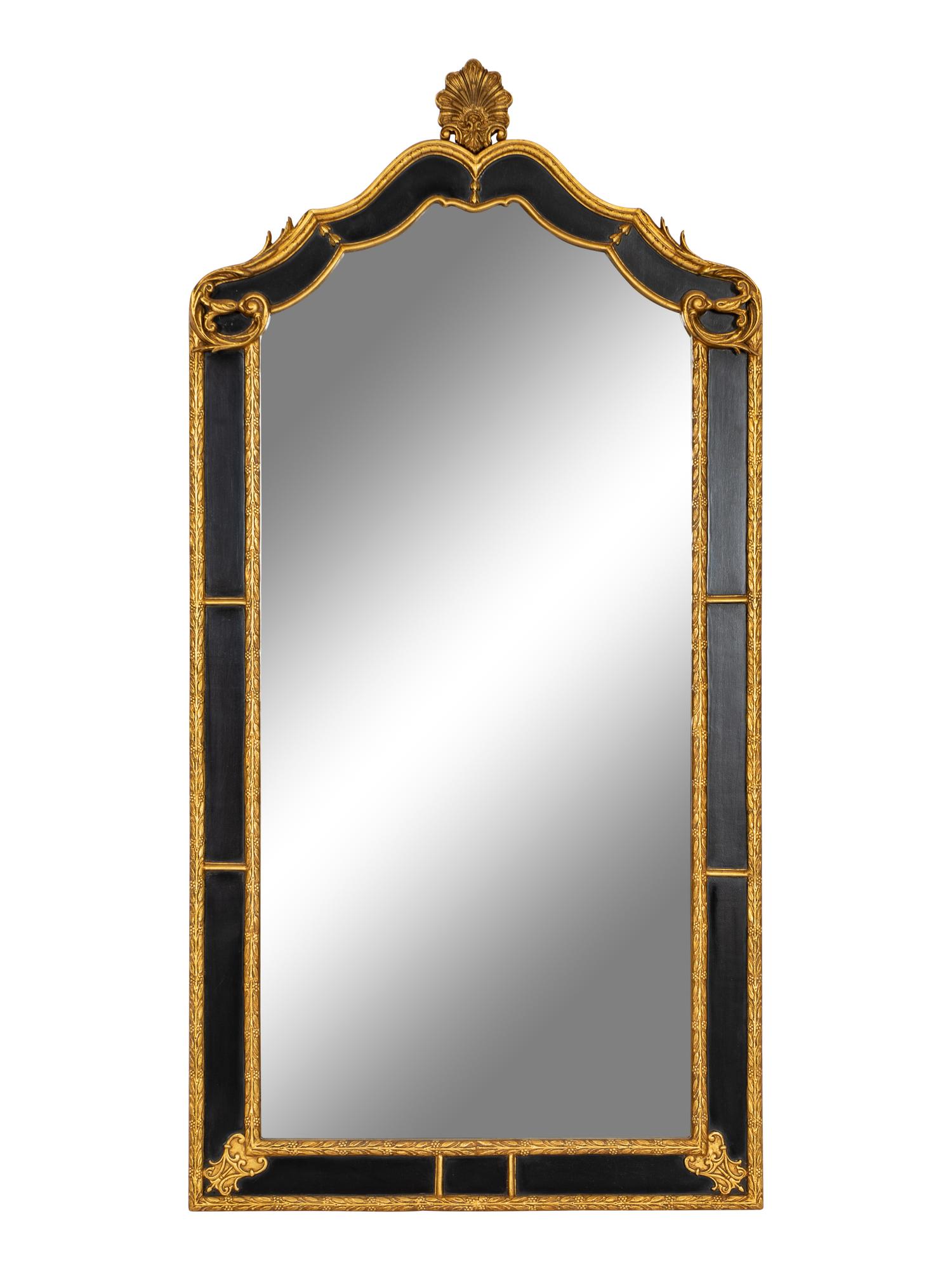 A Pair of Large Ebonized and Parcel Gilt Pier Mirrors