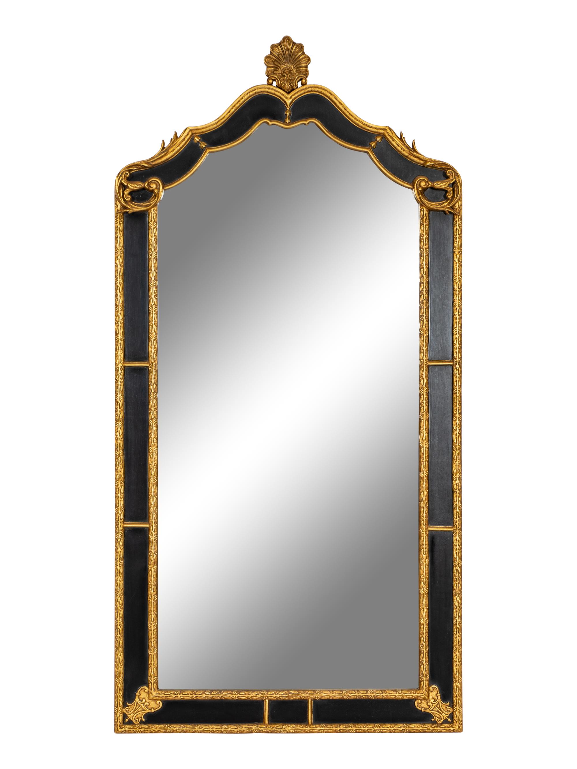 A Pair of Large Ebonized and Parcel Gilt Pier Mirrors